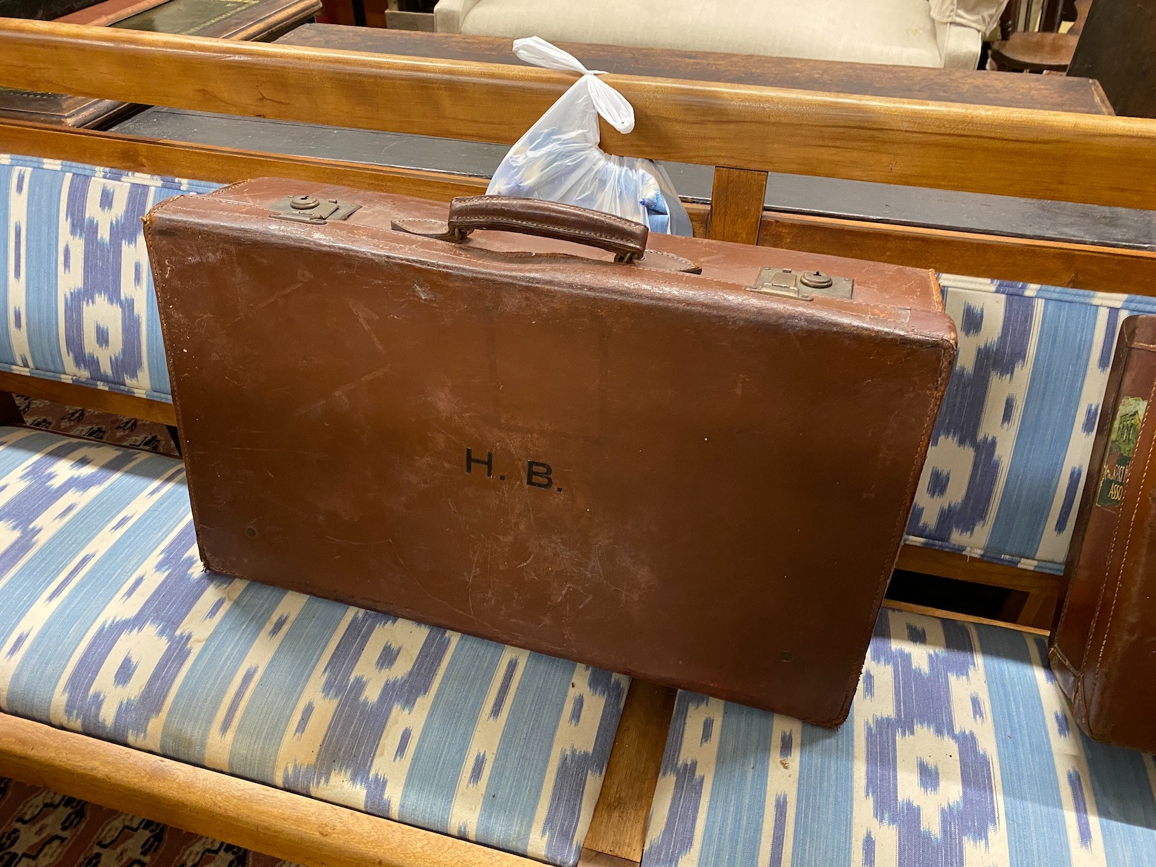 Four vintage suitcases, largest 82 x 53cm